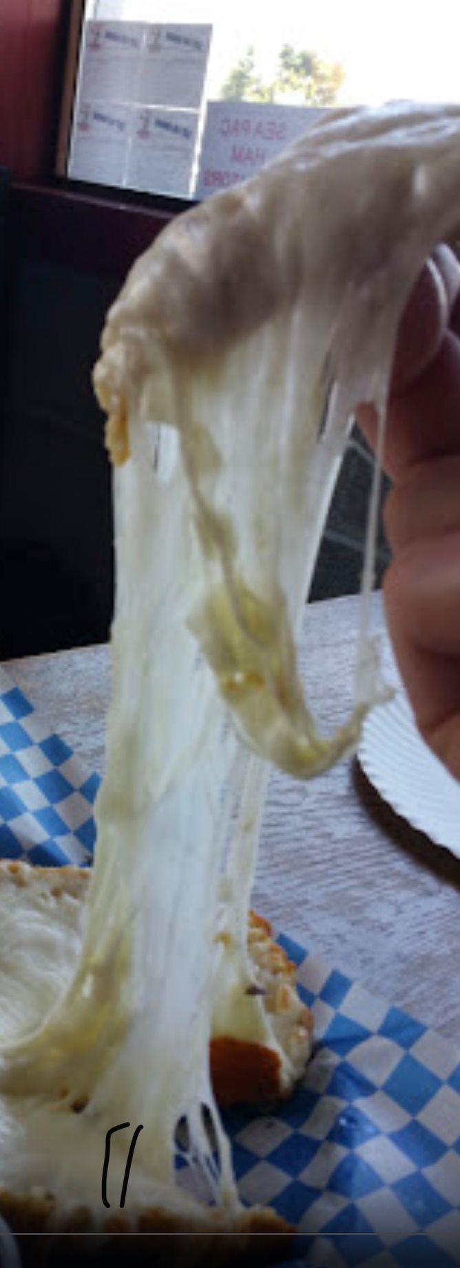 Picture of Stringy Mozzarella Cheese in Pizza Harbor